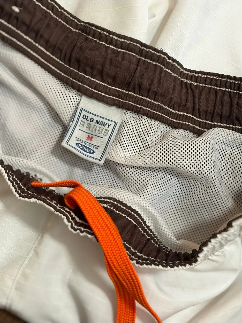 Old Navy White Swim Trunks with Brown Panels and Orange Trim